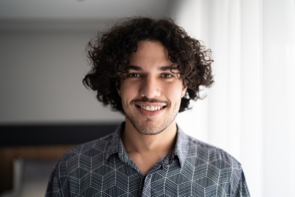 Portrait of a happy young man at home